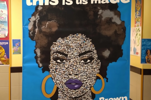 A small mosaic portrait of a woman with an afro, created from tiny photos, featuring gold hoop earrings and purple lips, set against a blue background with the text "this is us made."